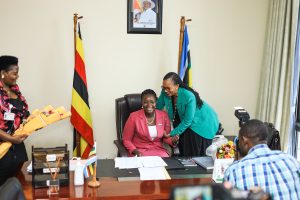 Hon Esther Anyakun (right) with Hon. Lillian Aber during the hand over ceremony